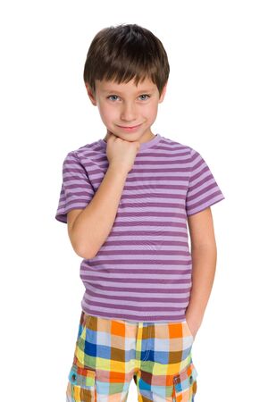 A cute little boy thinks on the white backgroundの写真素材