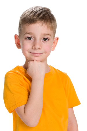 A thoughtful little boy on the white backgroundの写真素材