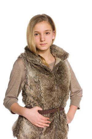 A pretty teen girl stands on the white backgroundの写真素材