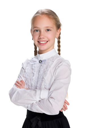 A portrait of a pretty schoolgirl against the white backgroundの写真素材