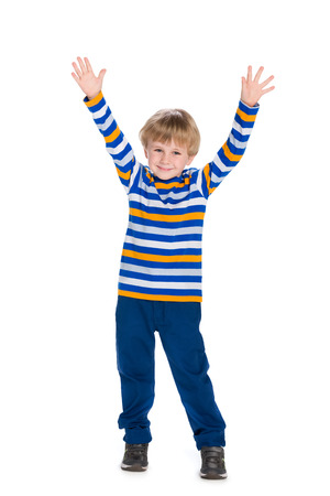 A cute little boy holds his hands upの写真素材