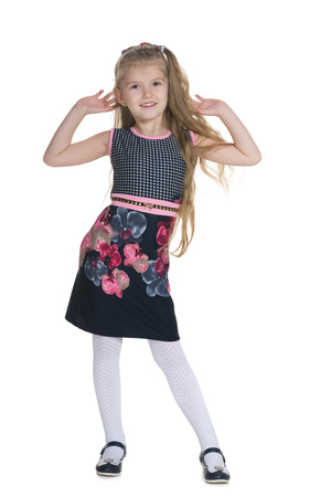 A pretty blonde little girl against the white backgroundの写真素材