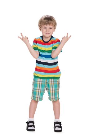 A cute little boy holds his hands with finger signの写真素材
