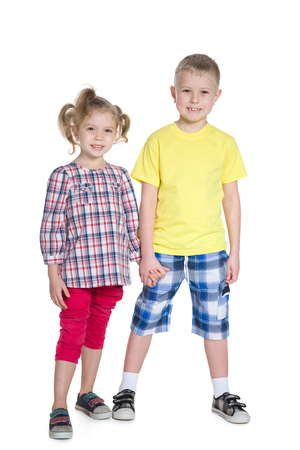 Two fashion blonde children are standing togetherの写真素材