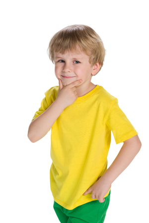 A cute little boy thinks on the white backgroundの写真素材