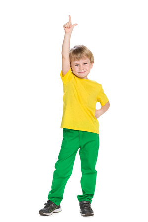 A smiling little boy shows his finger upの写真素材