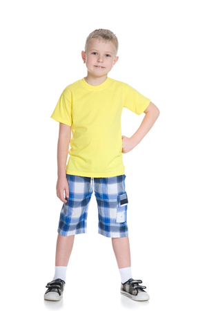A portrait of a smiling blond boy in a yellow shirtの写真素材