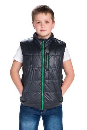 A portrait of a handsome young boy in a jacket against the white backgroundの写真素材