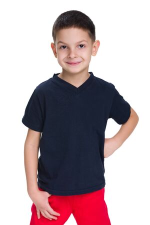 A portrait of a handsome young boy in a red shirt on the white backgroundの写真素材