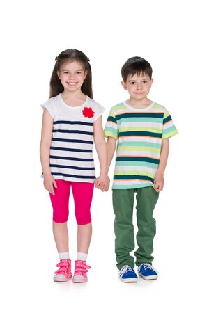 Two fashion kids on the white backgroundの写真素材