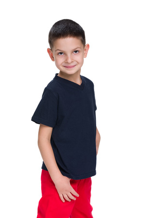 A profile portrait of a young boy on the white backgroundの写真素材
