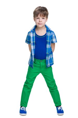A portrait of a handsome little boy in a blue shirtの写真素材