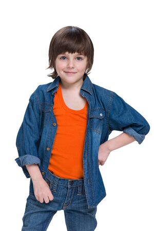 A portrait of a fashion little boy in a jeans suitの写真素材