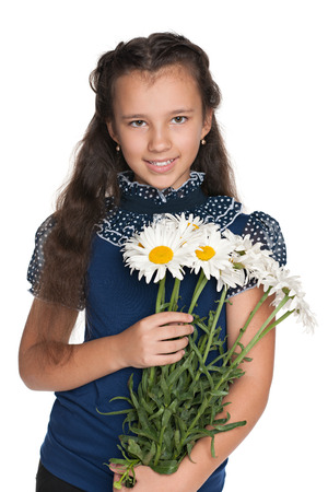 A portrait of a pretty young girl with flowers on the white backgroundの写真素材