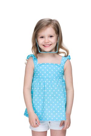 A laughing little girl with glasses on the white backgroundの写真素材
