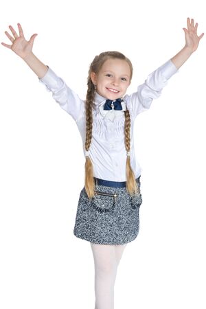 A smiling little girl holds his hands upの写真素材