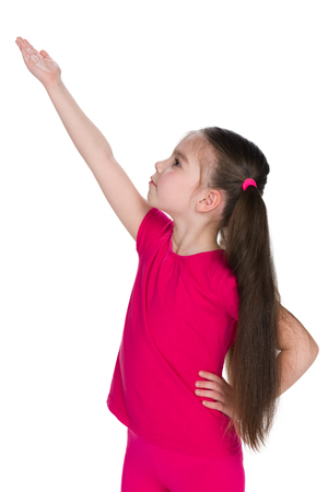 A little girl shows her palm to the side on the white backgroundの写真素材