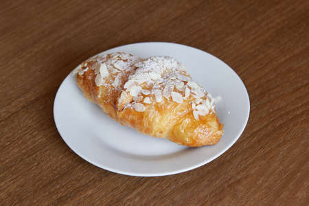 almond croissant with powdered sugarの写真素材