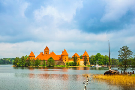 Panoramic view on Medieval old castle in Trakai, Lithuania placed on Galve lake Island ancient castle are one of the most popular touristic destinations and cultural center in Lithuania のeditorial素材