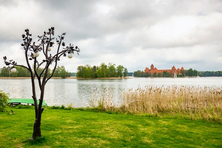 Panoramic view on Medieval old castle in Trakai, Lithuania placed on Galve lake Island ancient castle are one of the most popular touristic destinations and cultural center in Lithuania のeditorial素材