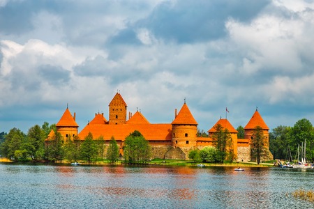 Panoramic view on Medieval old castle in Trakai, Lithuania placed on Galve lake Island ancient castle are one of the most popular touristic destinations and cultural center in Lithuania のeditorial素材