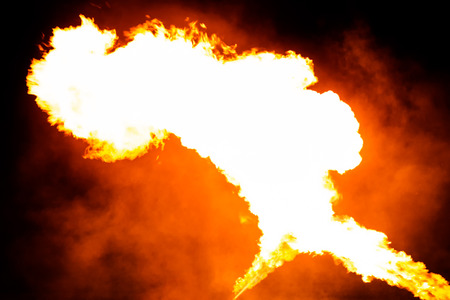 Flames or fire with smoke on midnightの写真素材