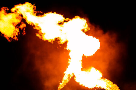 Flames or fire with smoke on midnightの写真素材
