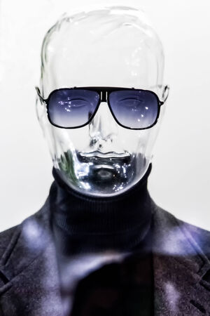 Male translucent mannequin in suit with sunglassesの写真素材