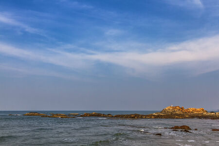 View from beach in Goa to Arabian sea. Rock near seaの写真素材
