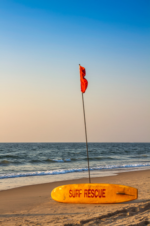 Rescue surfboard on the sand beach near the sea or oceanの写真素材