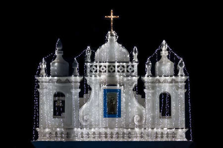 Illuminated church at the night on black backgroundの写真素材
