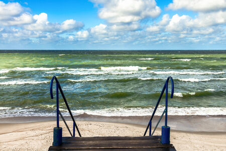 View on the Baltic sea coastline in Nida from stairway placed on dune  Lithuaniaの写真素材