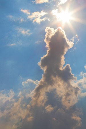 Sun and clouds on sky backgroundの写真素材