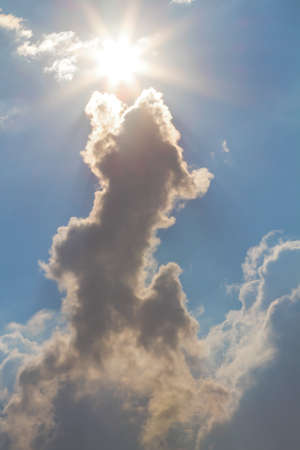 Sun and clouds on sky backgroundの写真素材