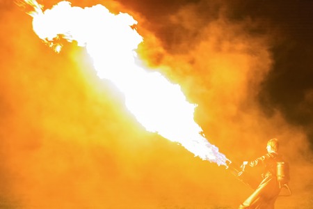 Minsk, Belarus - MAY 25, 2013  annual festival fire show  MIFF   Performance of artists on stage  Man with flamethrowerのeditorial素材