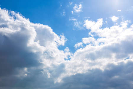 White fluffy clouds on blue sky backgroundの写真素材