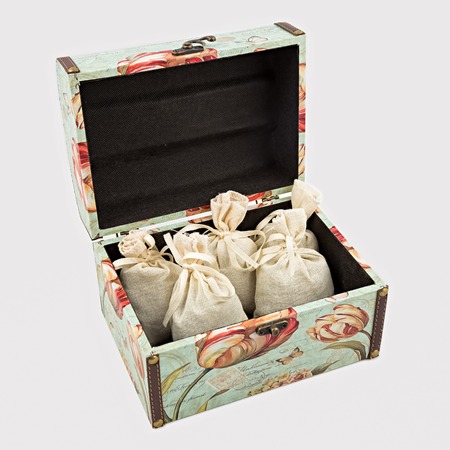 Gift box with textile pouches on white backgroundの写真素材