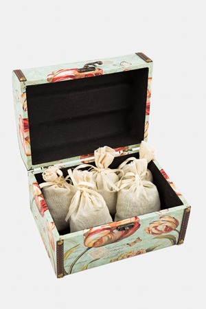 Gift box with textile pouches on white backgroundの写真素材