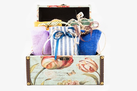 Decorative textile sachet pouches in gift box on white backgroundの写真素材