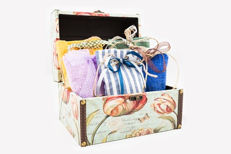 Decorative textile sachet pouches in gift box on white backgroundの写真素材