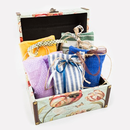 Decorative textile sachet pouches in gift box on white backgroundの写真素材