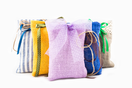 Decorative textile sachet pouches on white backgroundの写真素材