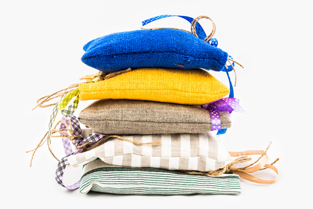 Decorative textile sachet pouches on white backgroundの写真素材