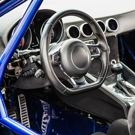Steering wheel in interior of the sports carの写真素材