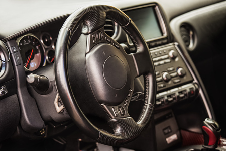 Steering wheel and dashboard in interior of the sports carの写真素材