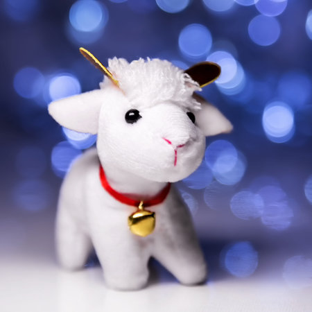 White sheep toy the Chinese symbol of 2015 year on blurred lights background