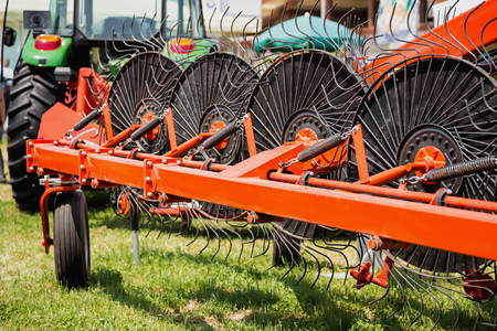 Hay rake farm machinery equipment in agricultural or farmland industryの写真素材