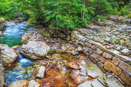 River with rocks and stones in mountain forest in South Koreaの写真素材