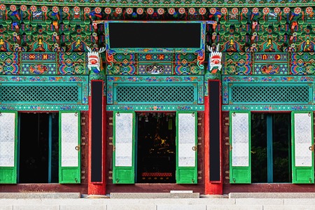 Entrance to buddhist monks temple with traditional decorative patterns in South Koreaの写真素材