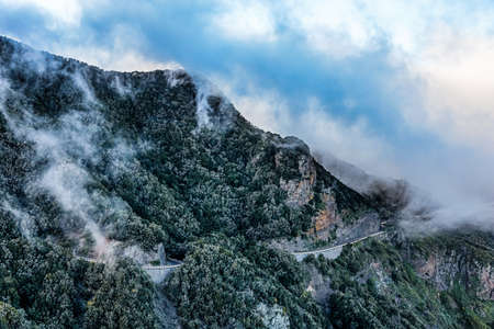Clouds over mountain with road in Tenerife Canary island, Spainの写真素材